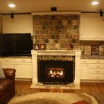 Fireplace with built in entertainment center and bookcases